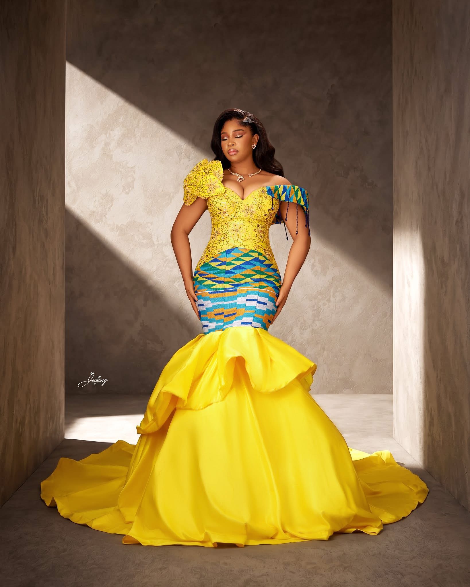 Kente mermaid gown in dramatic studio light