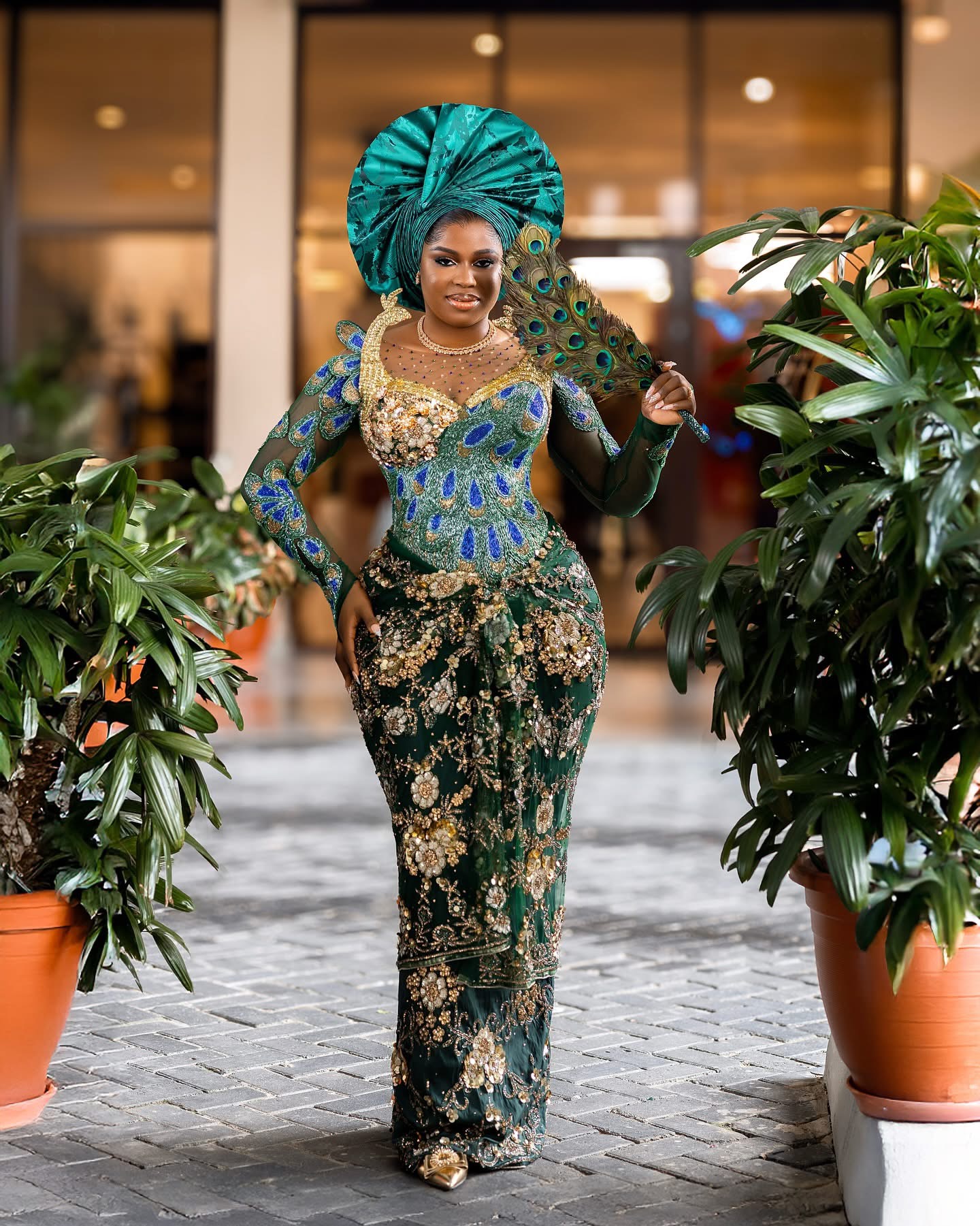 Green peacock traditional couture ensemble