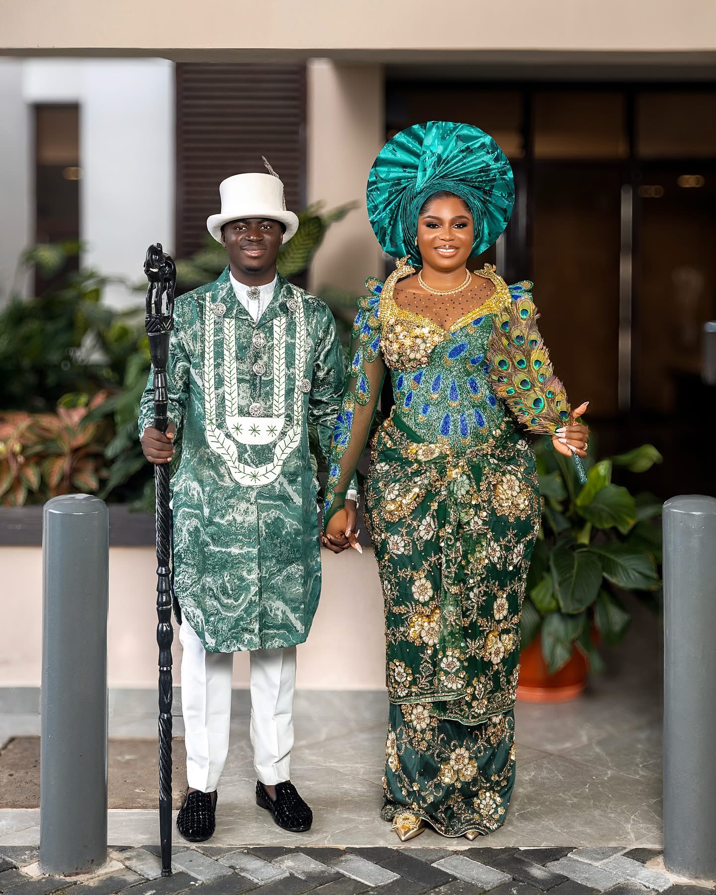 Green and gold traditional couture with dramatic gele headwrap
